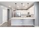 Modern kitchen featuring white cabinets, granite countertops and stainless steel appliances at 7618 S Lone Pine Pl, Gold Canyon, AZ 85118