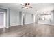 Spacious living room featuring modern finishes, wood-look floors and neutral wall colors at 7618 S Lone Pine Pl, Gold Canyon, AZ 85118