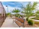 Park benches and desert landscaping near bocce ball courts behind a fence at 7618 S Lone Pine Pl, Gold Canyon, AZ 85118