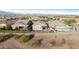 Aerial view showcasing fenced backyard with pool and covered patio space at 7618 S Lone Pine Pl, Gold Canyon, AZ 85118