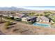 Aerial view showcasing fenced backyard with pool and covered patio space at 7618 S Lone Pine Pl, Gold Canyon, AZ 85118