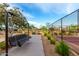 A nice swing bench next to a court with desert landscaping and desert vegetation at 7618 S Lone Pine Pl, Gold Canyon, AZ 85118