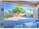 Backyard featuring paver patio, mature trees, and privacy walls at 853 E Ivanhoe Ct, Gilbert, AZ 85295