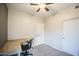 Spacious bedroom features carpet, ceiling fan, closet and a built-in desk at 853 E Ivanhoe Ct, Gilbert, AZ 85295
