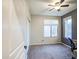 Neutral bedroom features carpet, ceiling fan, closet and a large window for natural light at 853 E Ivanhoe Ct, Gilbert, AZ 85295