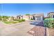 Charming single-story home with a well-maintained lawn, three-car garage, and extended driveway at 853 E Ivanhoe Ct, Gilbert, AZ 85295