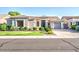 Beautiful single-story home featuring desert landscaping, a three car garage, and inviting front entrance at 853 E Ivanhoe Ct, Gilbert, AZ 85295