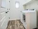 Functional laundry room with modern appliances, white cabinets and ample storage at 853 E Ivanhoe Ct, Gilbert, AZ 85295