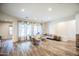 Inviting living room showcases hardwood floors, modern furniture, and window coverings at 853 E Ivanhoe Ct, Gilbert, AZ 85295