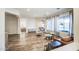 Open-concept living area with wood flooring, contemporary furnishings, and neutral color palette at 853 E Ivanhoe Ct, Gilbert, AZ 85295