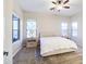 Bright main bedroom features neutral walls, carpet, ceiling fan and large windows at 853 E Ivanhoe Ct, Gilbert, AZ 85295