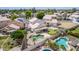 Aerial view featuring a backyard with pool, putting green, and covered patio in residential neighborhood at 910 S Crossbow Ct, Chandler, AZ 85225