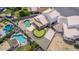 Aerial view of backyard with a pool, a putting green, and patio area for outdoor entertaining at 910 S Crossbow Ct, Chandler, AZ 85225
