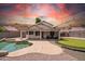 Outdoor oasis featuring a private pool, putting green, and covered patio with stylish furniture at 910 S Crossbow Ct, Chandler, AZ 85225
