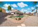 Aerial view of the house featuring a backyard pool, putting green, and covered patio at 910 S Crossbow Ct, Chandler, AZ 85225