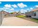 Large backyard with putting green, covered patio, and low maintenance landscaping at 910 S Crossbow Ct, Chandler, AZ 85225