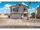 Charming two-story home featuring a well-maintained front yard and a two-car garage at 910 S Crossbow Ct, Chandler, AZ 85225