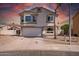 Charming two-story home with an attached garage and desert-friendly landscaping at 910 S Crossbow Ct, Chandler, AZ 85225