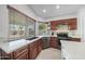 Well-equipped kitchen with stainless steel appliances, ample counter space, and natural light at 910 S Crossbow Ct, Chandler, AZ 85225