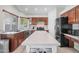 Spacious kitchen featuring an island, stainless steel appliances, and ample cabinet space at 910 S Crossbow Ct, Chandler, AZ 85225