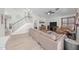 Open-concept living room with modern staircase, comfortable seating, and a view to the second floor at 910 S Crossbow Ct, Chandler, AZ 85225