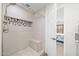 Modern tiled shower with a built-in bench and a bedroom view at 910 S Crossbow Ct, Chandler, AZ 85225