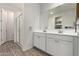 Clean bathroom with a double sink vanity and a glass-enclosed shower at 9312 E Spiral Ave, Mesa, AZ 85212
