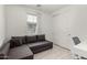 Bright bedroom featuring a large window, closet and comfortable seating area at 9312 E Spiral Ave, Mesa, AZ 85212