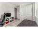 Cozy bedroom with a workstation and sliding door closet, offering ample storage at 9312 E Spiral Ave, Mesa, AZ 85212