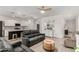 Open-concept living room with modern furnishings and a view to the gourmet kitchen at 9312 E Spiral Ave, Mesa, AZ 85212