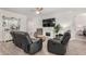 Spacious living room showcasing sleek furniture, modern fireplace, and bright, neutral decor at 9312 E Spiral Ave, Mesa, AZ 85212