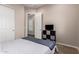 Bright bedroom with a closet and storage cube, showcasing a queen bed and comfortable, relaxing space at 9678 W Patrick Ln, Peoria, AZ 85383