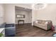 Well lit bonus room with vinyl floors and comfortable furniture at 9678 W Patrick Ln, Peoria, AZ 85383