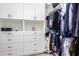 A walk-in closet with custom shelving and ample storage space for an organized wardrobe at 9678 W Patrick Ln, Peoria, AZ 85383