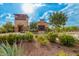Attractive community entrance with desert landscaping and iconic signage against a sunny sky at 9678 W Patrick Ln, Peoria, AZ 85383