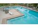 A refreshing community pool with lounge chairs and umbrellas offers a relaxing amenity for residents at 9678 W Patrick Ln, Peoria, AZ 85383