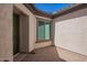 Charming gated courtyard featuring a paver floor with access to the front door of the house at 9678 W Patrick Ln, Peoria, AZ 85383