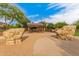 A park with a shaded picnic area and playground sits between rock features at 9678 W Patrick Ln, Peoria, AZ 85383