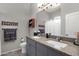 Bathroom featuring double sinks, granite countertops, and decorative hardware at 10359 E Los Lagos Vista Ave, Mesa, AZ 85209
