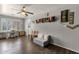 Bonus room showcasing natural light, wood flooring, sofa, and comfortable seating at 10359 E Los Lagos Vista Ave, Mesa, AZ 85209