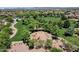Aerial view of a lush community park with playground, trees, and green space, perfect for outdoor activities and Gathering fun at 10359 E Los Lagos Vista Ave, Mesa, AZ 85209