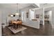 Dining room features a wood table and chairs, with easy access to the foyer at 10359 E Los Lagos Vista Ave, Mesa, AZ 85209