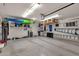 Spacious garage with ample storage and organization features for tools and equipment at 10359 E Los Lagos Vista Ave, Mesa, AZ 85209