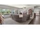 Open living area features a large sectional sofa and backyard views at 10359 E Los Lagos Vista Ave, Mesa, AZ 85209