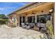 Spacious covered patio with an outdoor kitchen, living area, and view of the pool at 10359 E Los Lagos Vista Ave, Mesa, AZ 85209