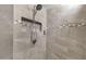 Modern shower with gray tile, mosaic accent, and convenient built-in shelf at 10359 E Los Lagos Vista Ave, Mesa, AZ 85209