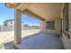 Covered back patio overlooking a spacious yard, ideal for outdoor gatherings and relaxation at 10548 W Crown King Rd, Tolleson, AZ 85353