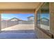 Covered backyard featuring a window and a concrete slab at 10548 W Crown King Rd, Tolleson, AZ 85353