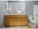 Bathroom featuring a double vanity, mirror, toilet, and tiled floors at 10548 W Crown King Rd, Tolleson, AZ 85353