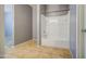 Bathroom featuring a tub, neutral colored walls and tile flooring at 10548 W Crown King Rd, Tolleson, AZ 85353